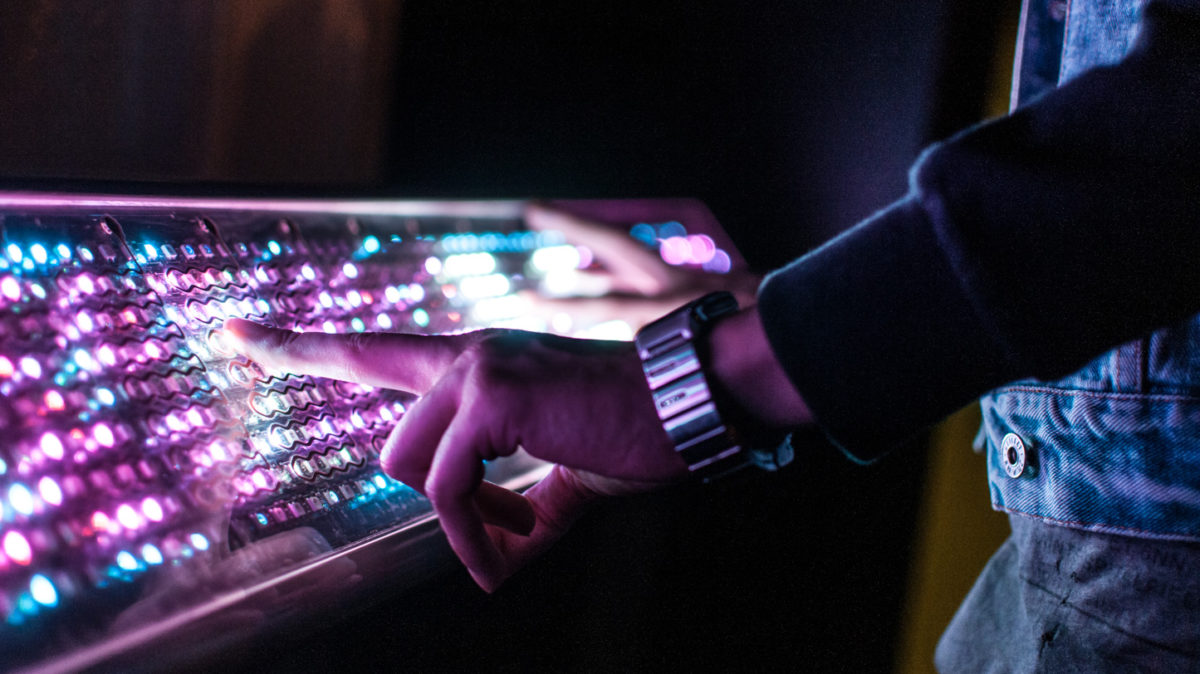 Close up of hands playing Light Synth